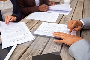 Business people reviewing contracts